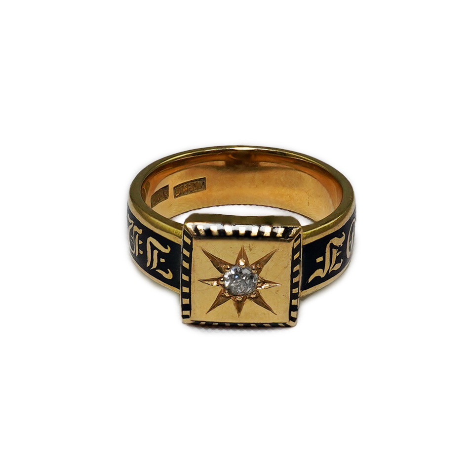 A 19th century 18ct gold, black enamel and single stone diamond set 'In Memory Of' ring